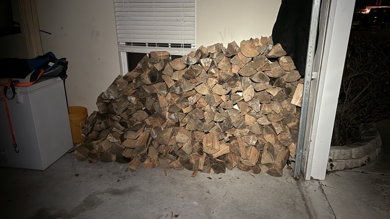 A load delivered and piled inside a customer's garage, right where they pointed, no rack.